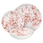 Zestaw talerzy Apulia Tognana Scapol: talerz obiadowy, soupy i deserowy, wykonane z wysokiej jakości porcelany z zielonym wzorem w plamki.