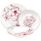 prezentacja serwisu obiadowego colibri z białej porcelany z czerwono różowym wzorem składającego się z 3 talerzy na białym tle